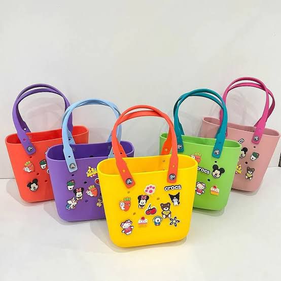 Crocs Classic Tote waterproof bags with Jibbitz charms attached