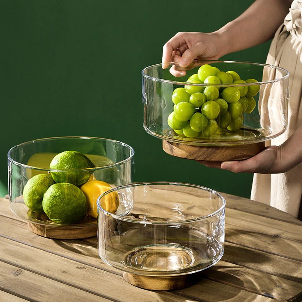 Glass fruit bowl with a wooden base