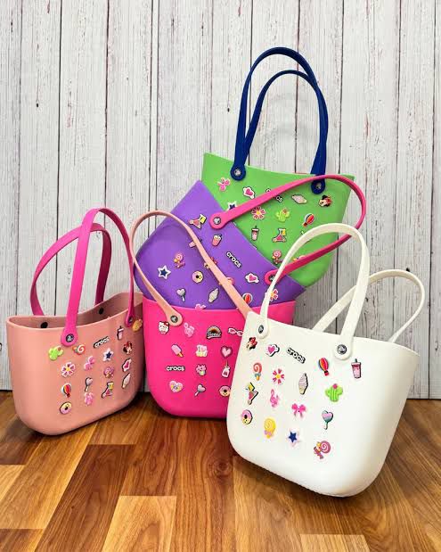 Crocs Classic Tote waterproof bags with Jibbitz charms attached